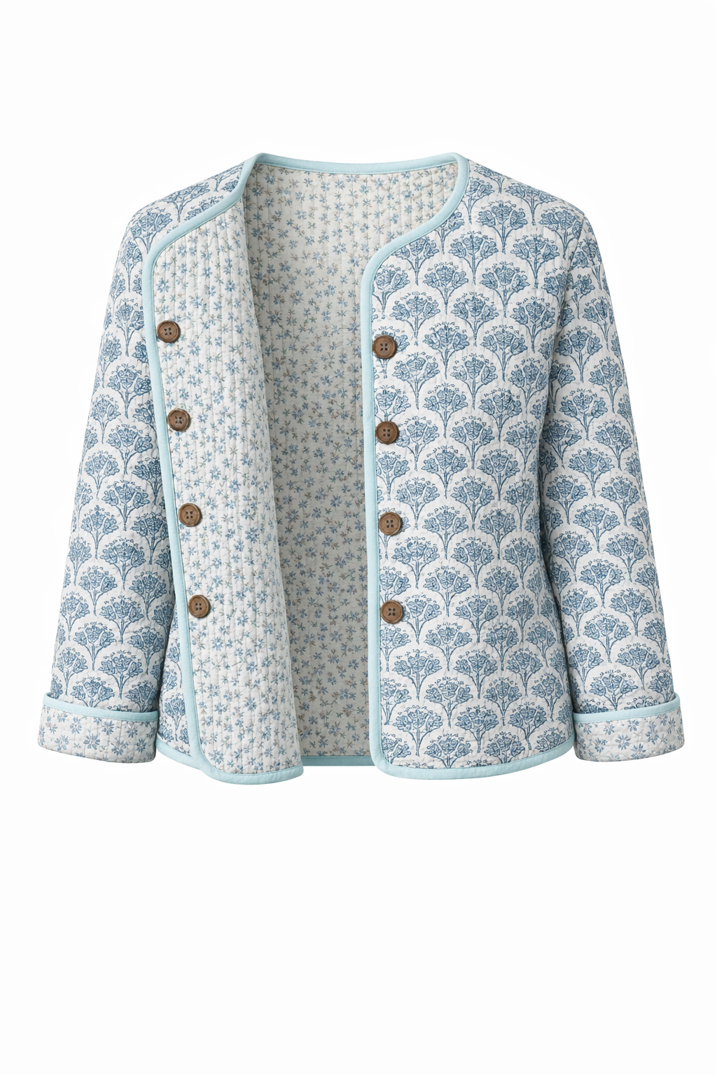 Wood block printed cotton quilted reversible jacket in soft blues.