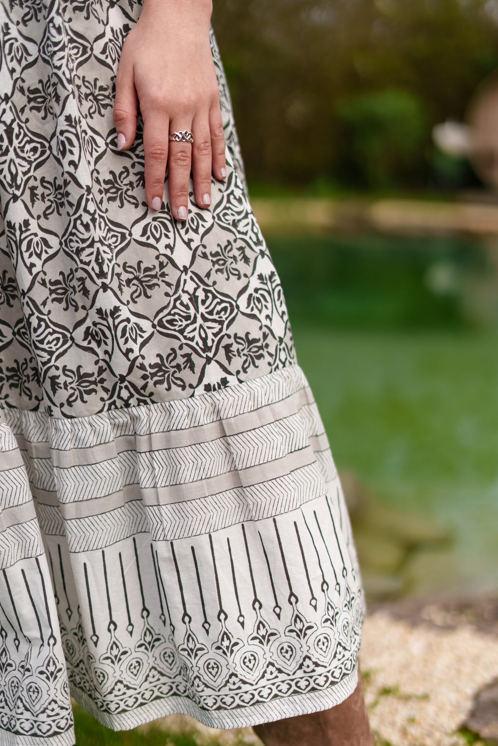 Aria Black and ecru woodblock print midi dress with tie front detail. 100% cotton