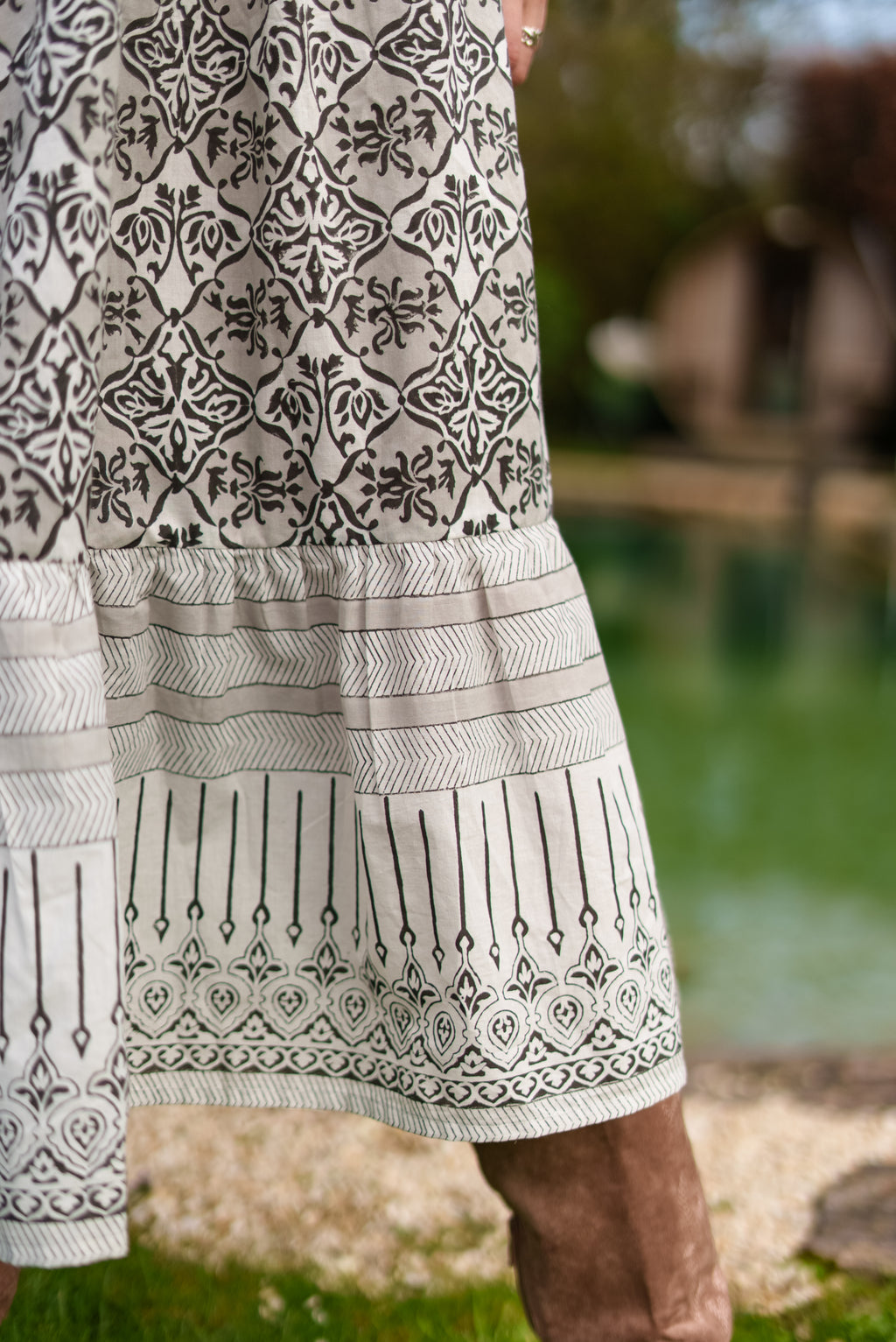 Aria Black and ecru woodblock print midi dress with tie front detail. 100% cotton