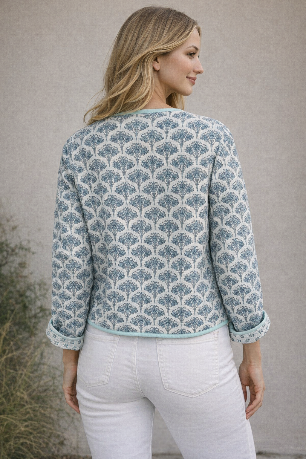 Wood block printed cotton quilted reversible jacket in soft blues.